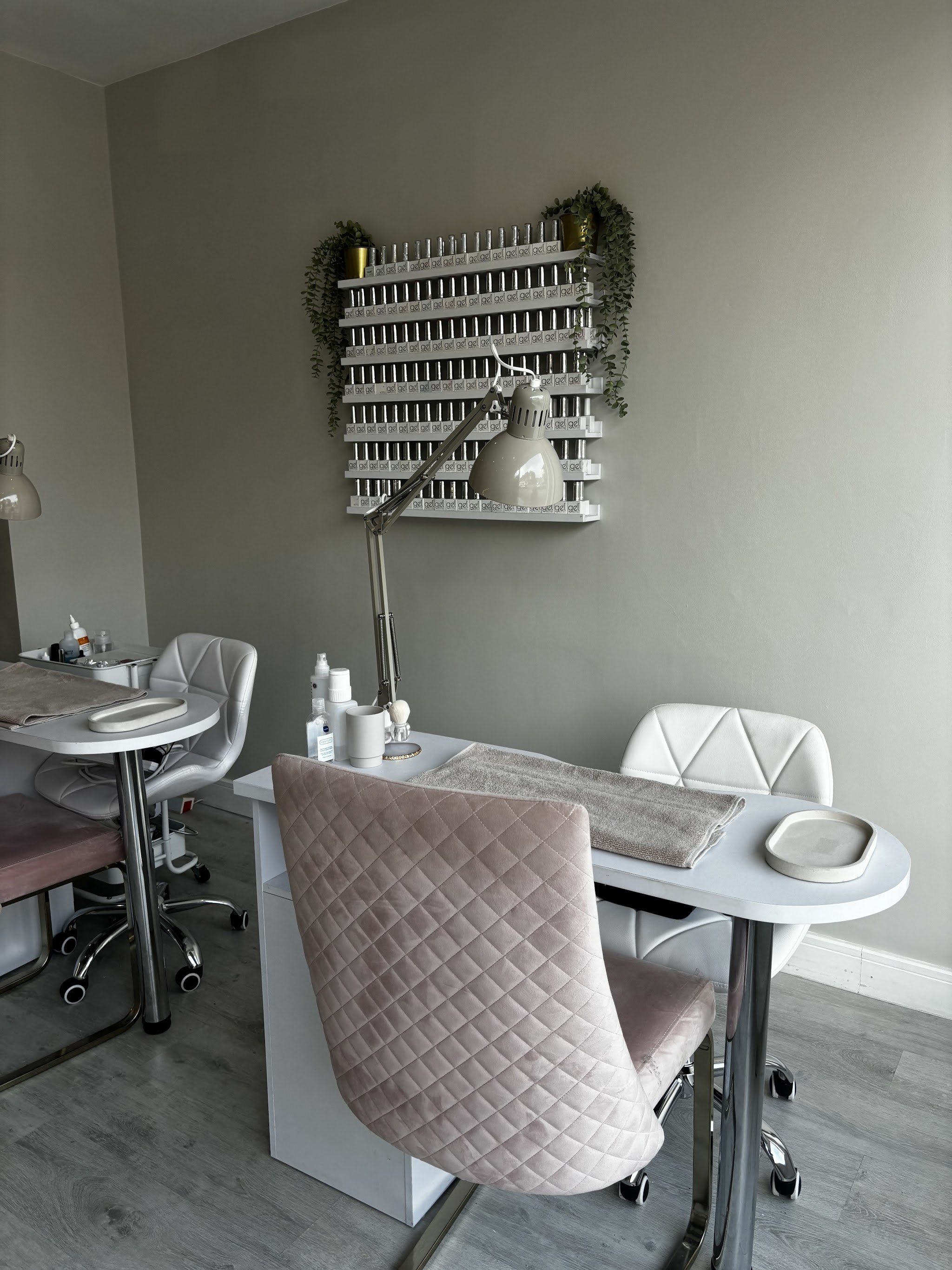 Blush manicure chairs and a wall of nail colours at the Horsforth salon